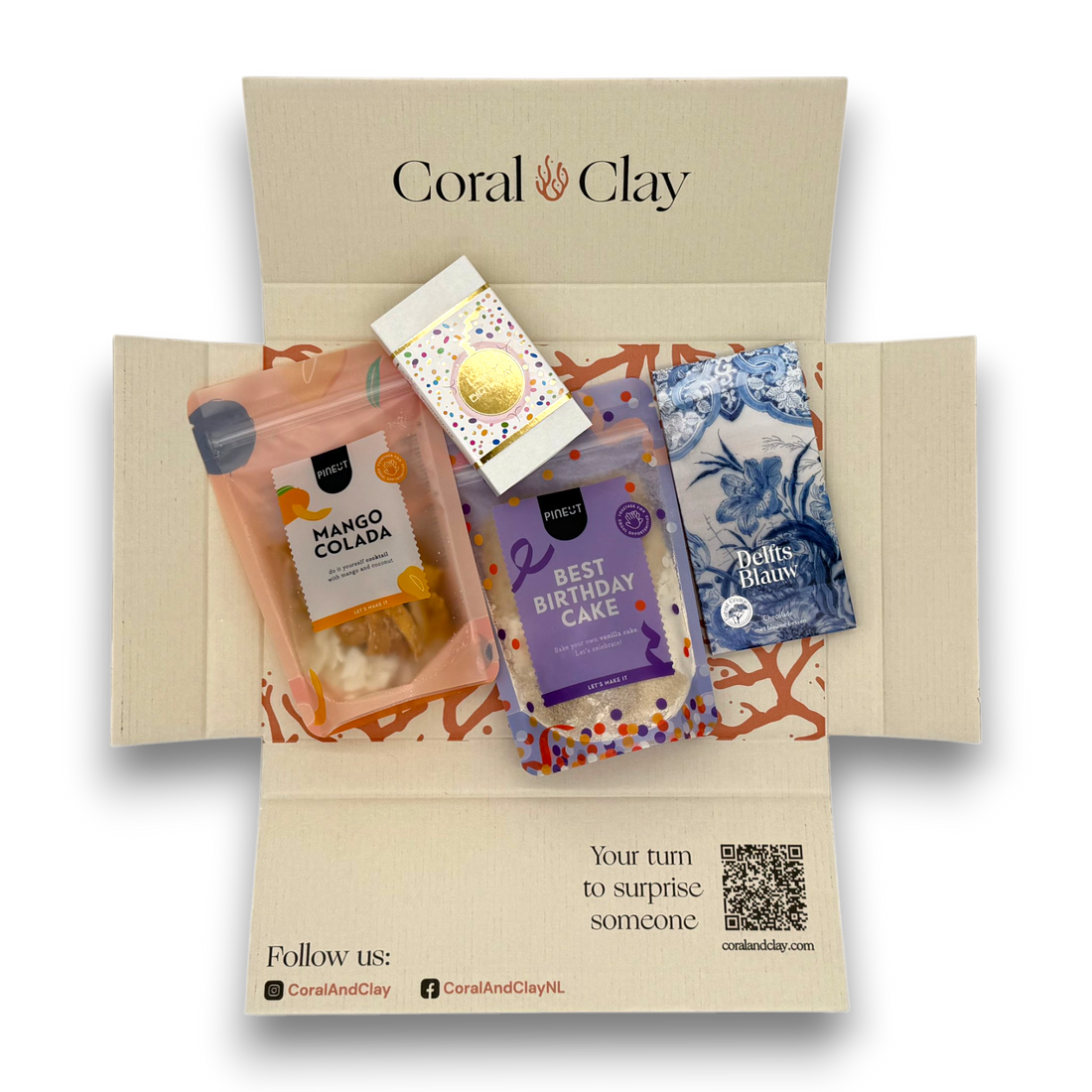 Collection of products including a box, packaging, and a book on a white background