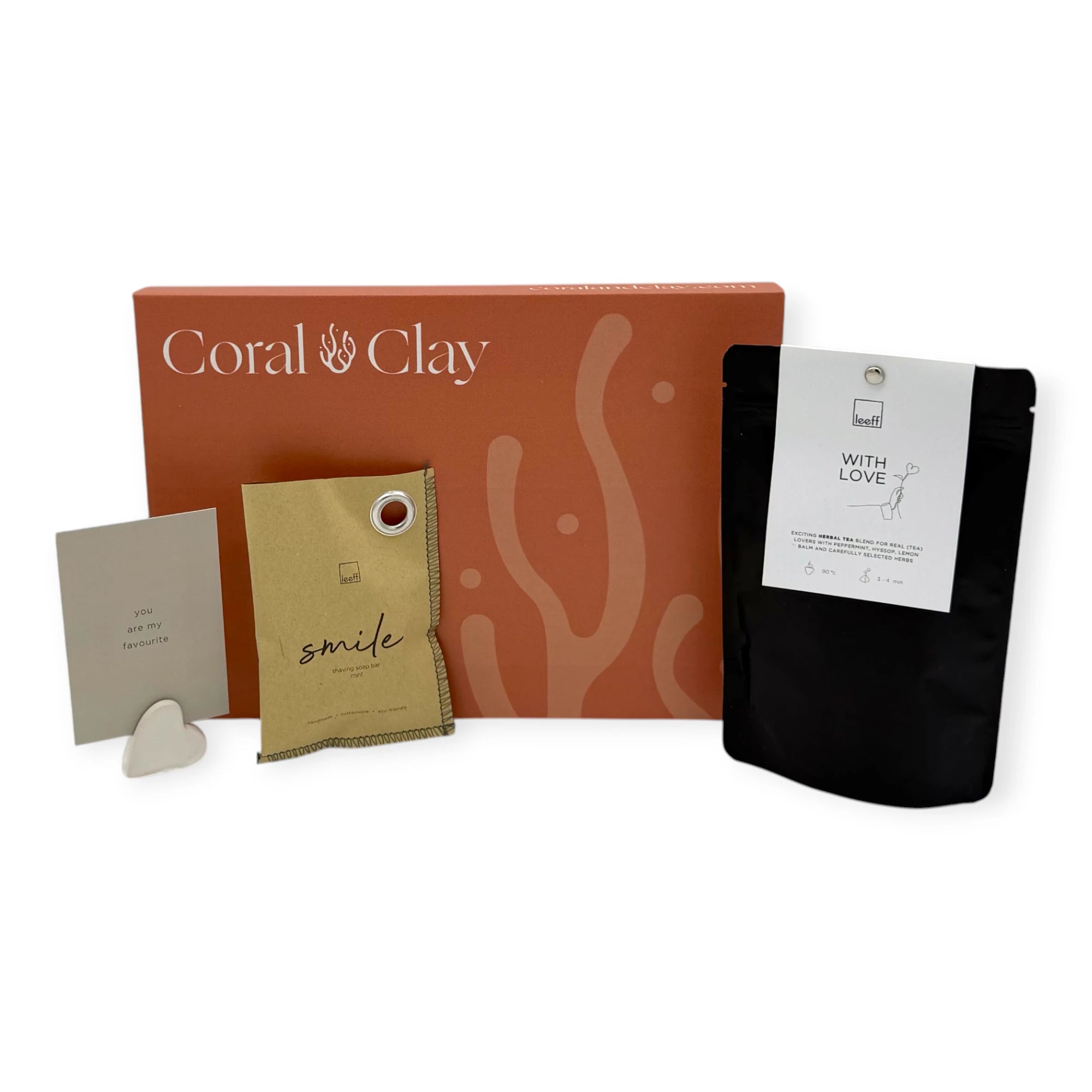 Coral & Clay With Love Letterbox Gift displayed with Leeff Smile sachet, With Love herbal tea pouch, and a minimalist message card with ceramic heart stand.