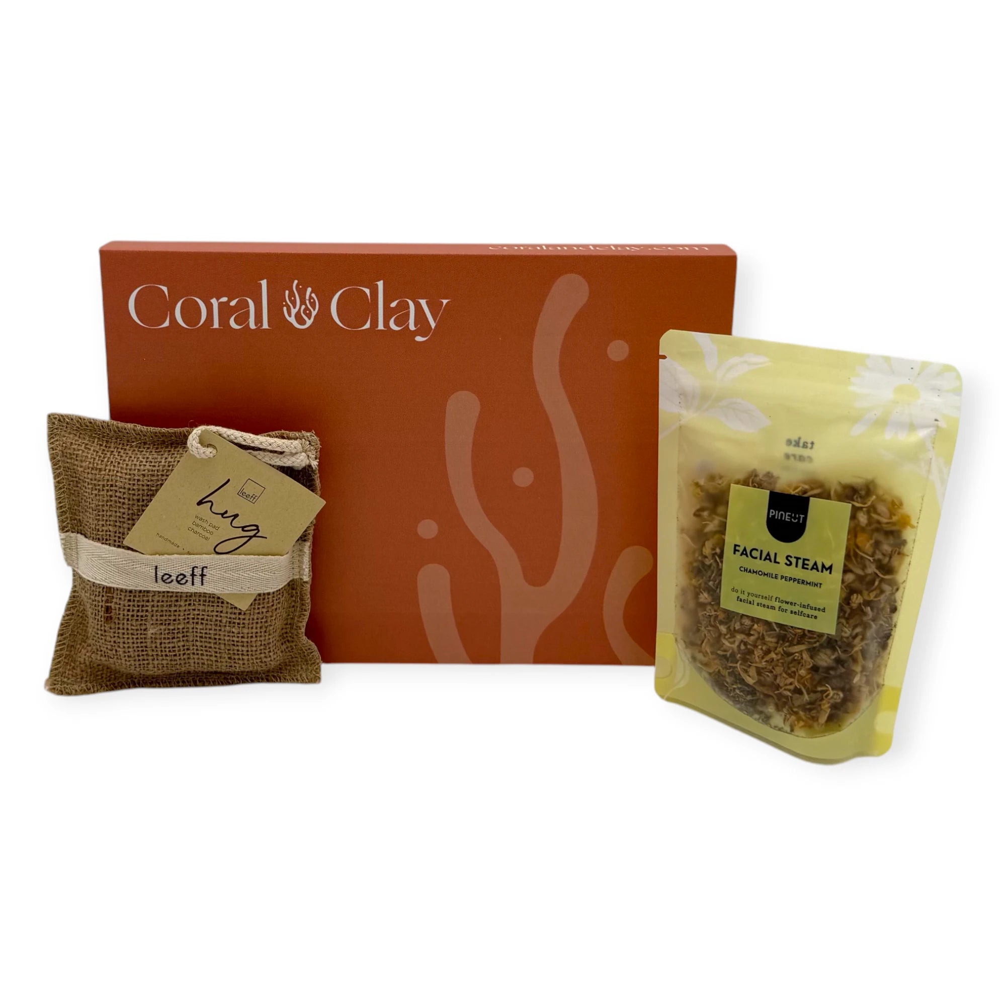 Coral & Clay Calm Moments Letterbox Gift displayed with a Leeff ‘Hug’ scented sachet and Pineut chamomile peppermint facial steam.