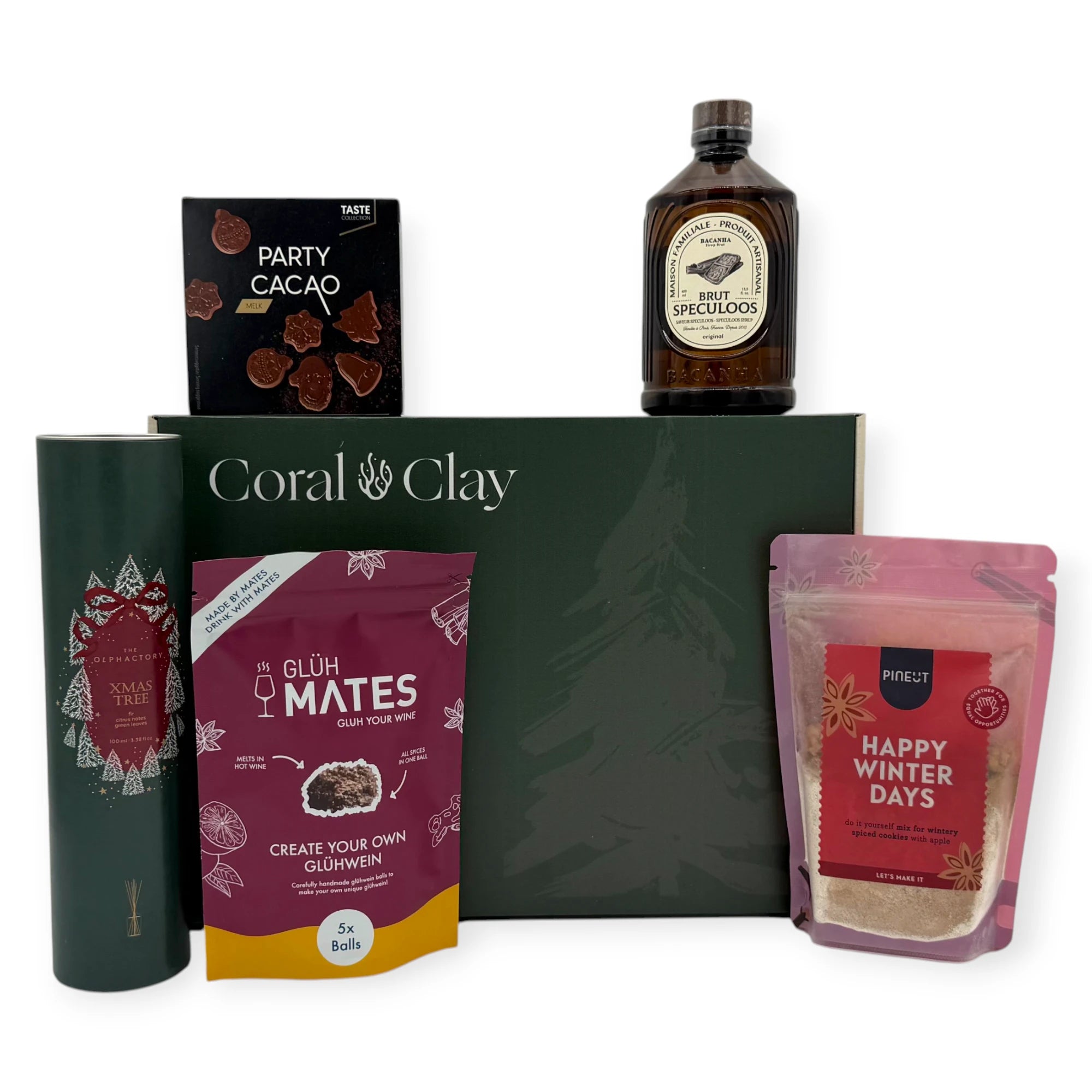 Christmas Scents Signature Gift displayed with Coral & Clay Christmas box and winter treats: glühwein mix, festive cookie mix, speculoos syrup, Christmas tree diffuser, and milk-chocolate Party Cacao shapes.”