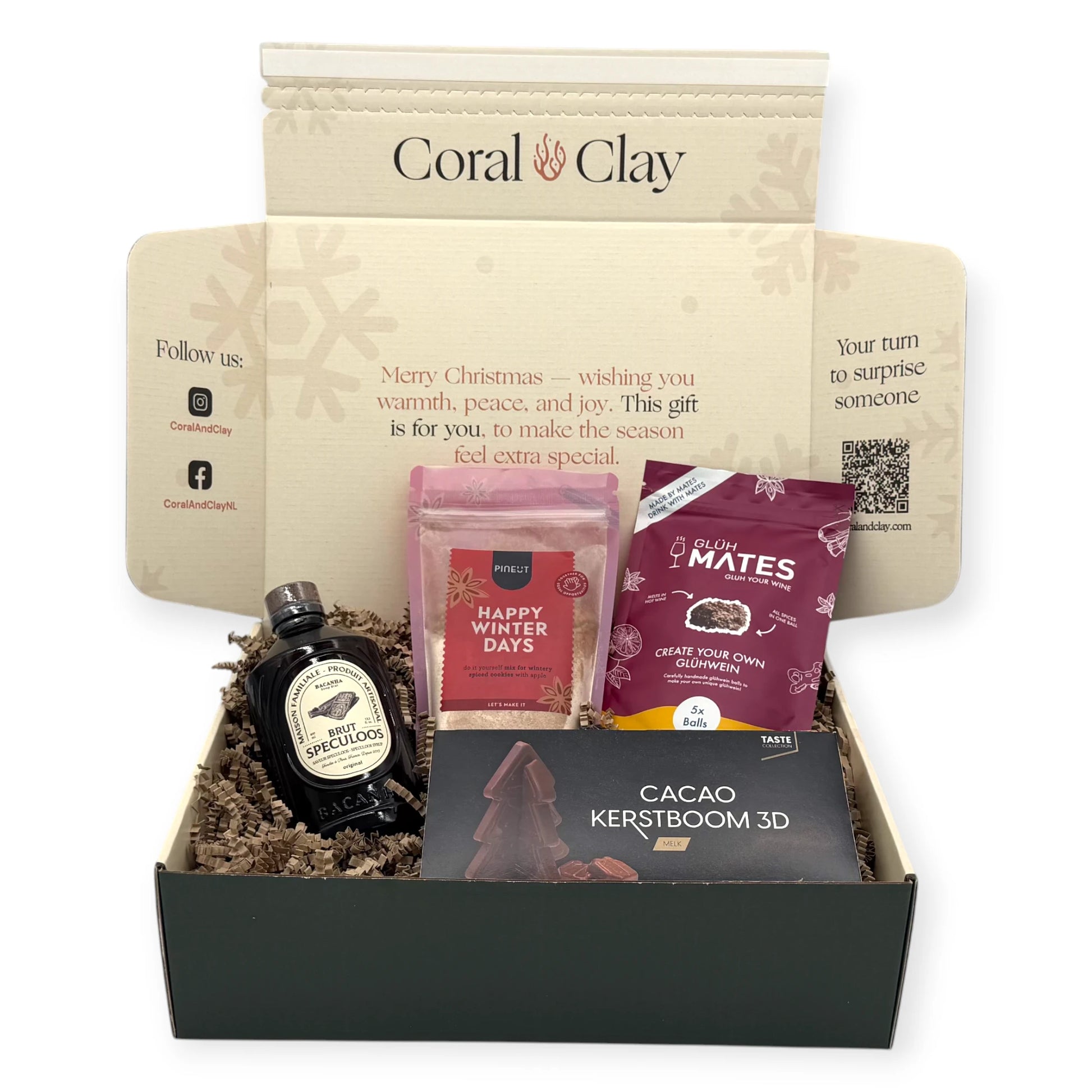 Christmas Delight Signature Gift items displayed with the Coral & Clay Christmas box, including 3D cacao tree chocolate, glühwein mix, winter cookie mix, and Brut Speculoos syrup.