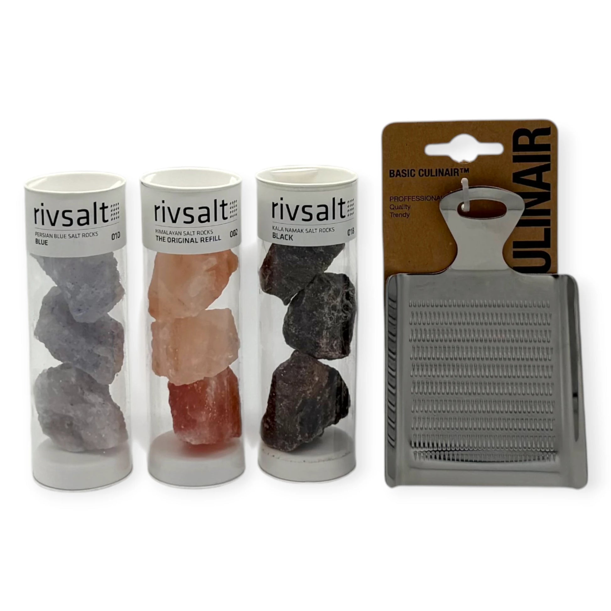 Rivsalt Crystal Colours gift set contents displayed on white background, featuring three tubes of Rivsalt salt rocks in blue, black, and Himalayan pink alongside a stainless-steel Culinair grater.