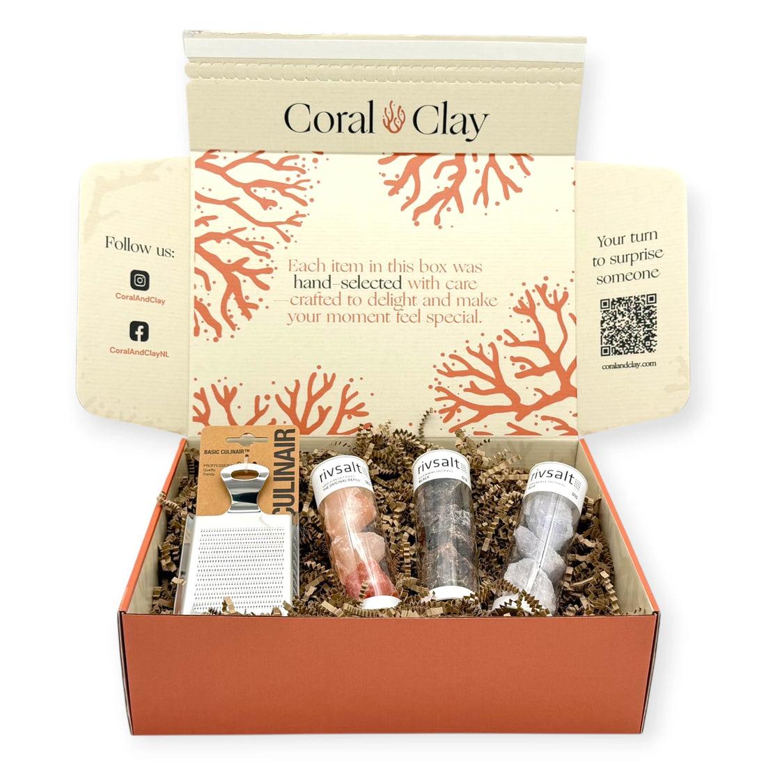 Rivsalt Crystal Colours Signature Gift Box by Coral & Clay, showing three Rivsalt salt rock tubes and a stainless-steel grater arranged in front of the premium coral-coloured gift box.