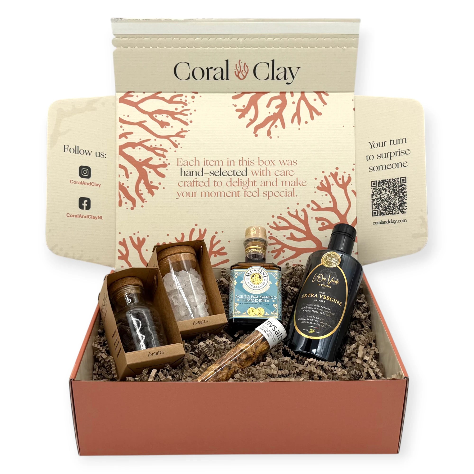 Top-down view of the Premium Kitchen Essentials Signature Gift Box showing neatly arranged gourmet olive oil, balsamic vinegar, Rivsalt salt rocks, chili flakes, and artisan spices inside the box.