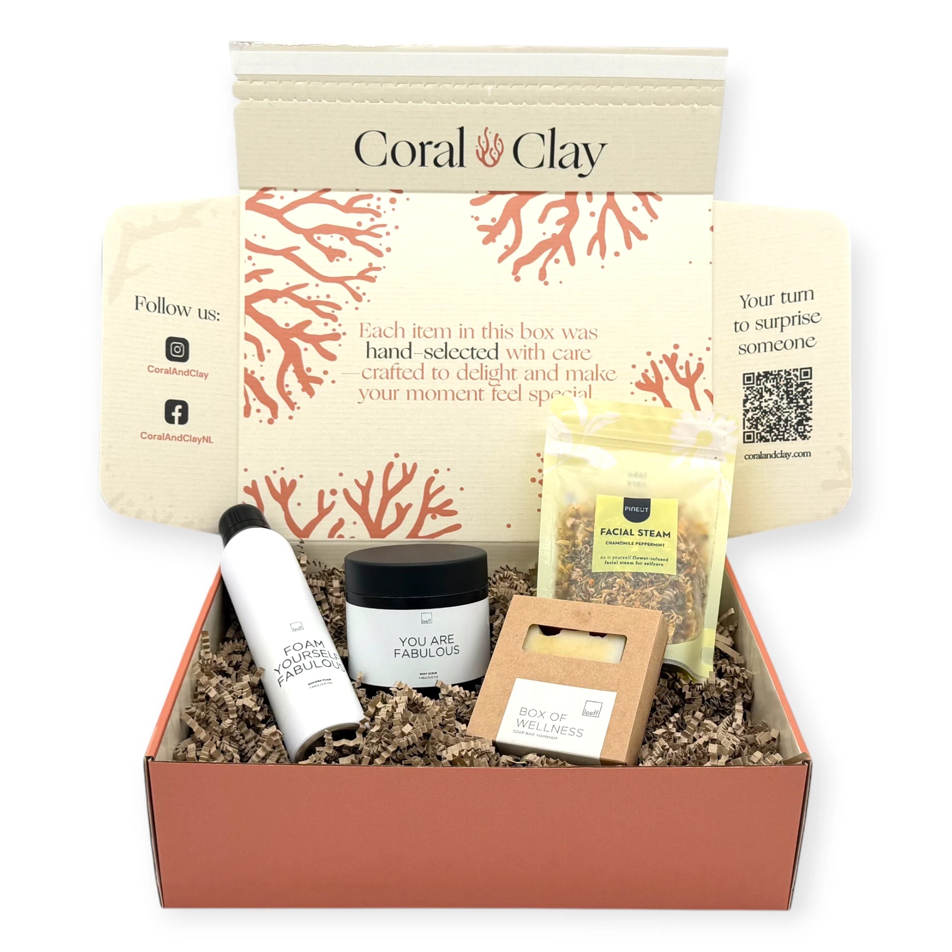 Top-down view of the Signature Wellness Ritual gift box with Leeff shower foam, body scrub, wellness soap bar, and Pineut Facial Steam arranged inside.