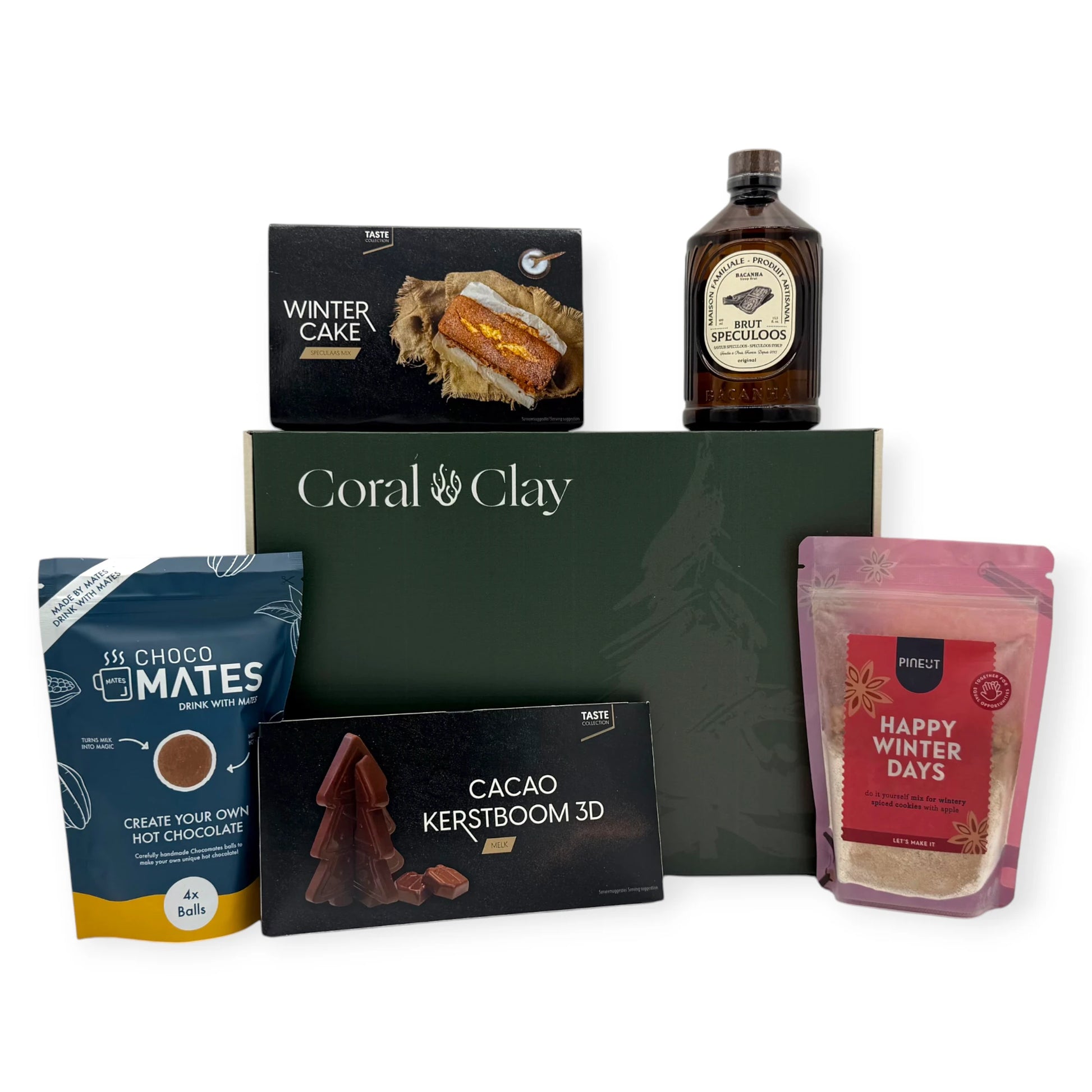 Coral & Clay Winter Sweets Signature Gift Box in deep green with all products arranged around it: Winter Cake mix, Speculoos liqueur, Choco Mates hot chocolate balls, Happy Winter Days cookie mix, and 3D milk chocolate Christmas tree.