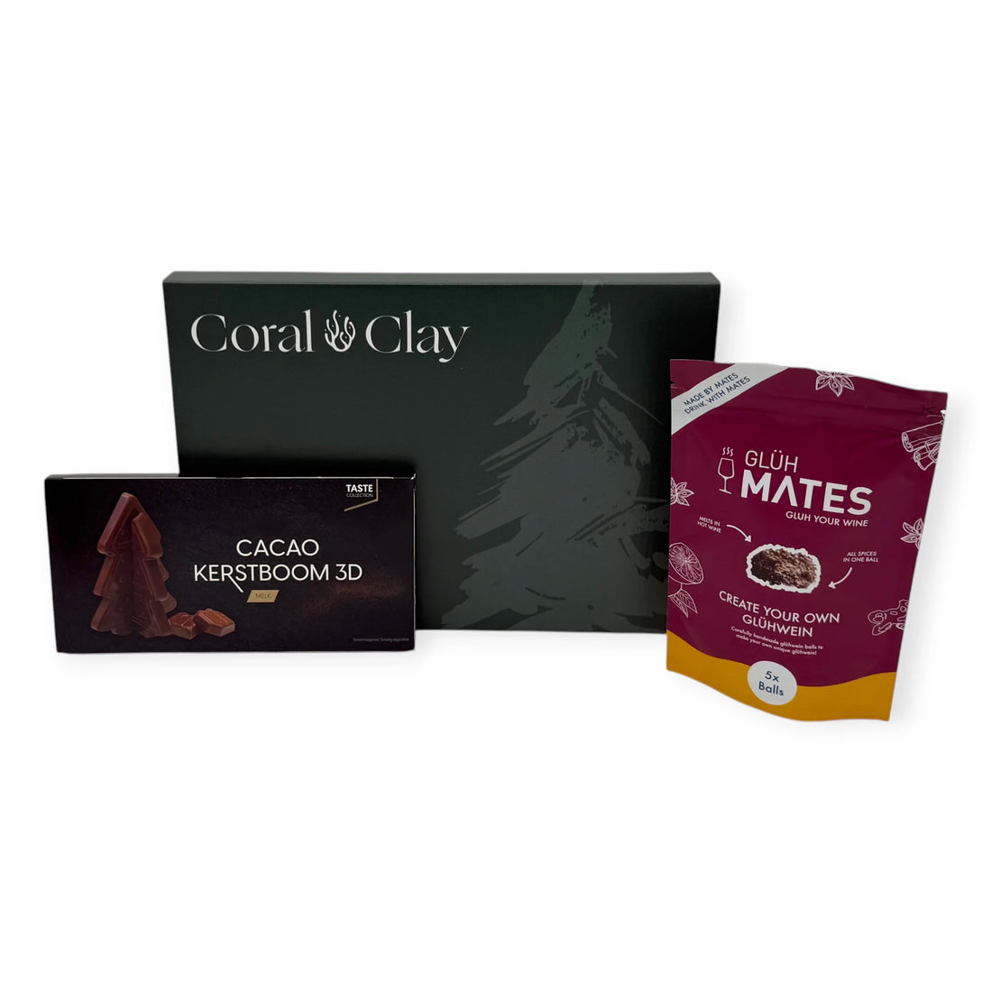 Coral & Clay Festive Flavours Christmas Letterbox Gift displayed with Glüh Mates glühwein mix and a 3D milk chocolate Christmas tree bar.
